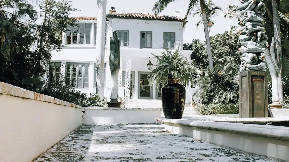 Spanish-style concrete tile roof on a Miami home under a clear blue sky